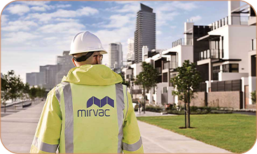 Site worker with exterior building & walkway image